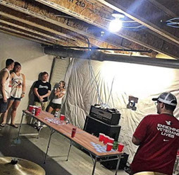 play beer pong at party with friends